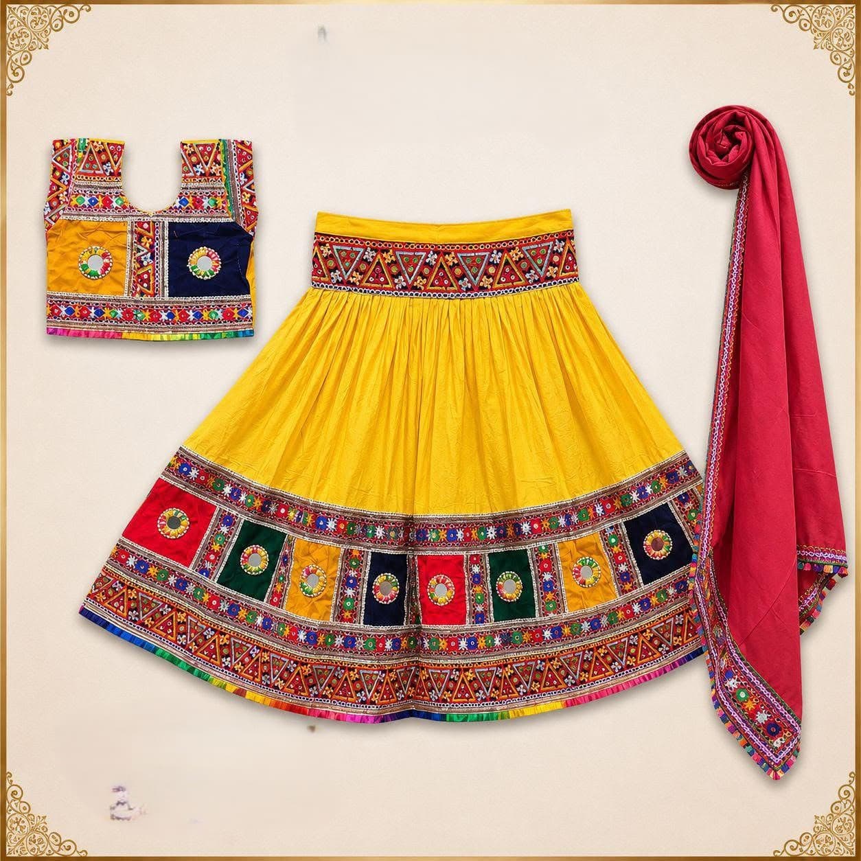 Yellow skirt with a border of coloured mirror-work patches, embroidered mirror blouse and a red dupatta with an embroidered edge